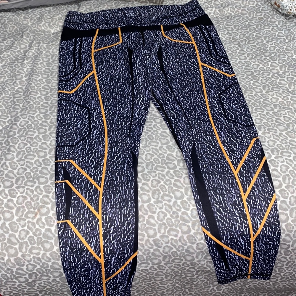 GRRRL Geometric Flash Next Level Leggings in Hiedi